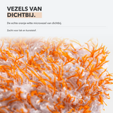 Close-up van de zachte oranje-witte vezels van de Carmotec Washandschoen